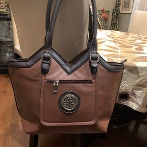 KMO tote bag, brown,18x12, multiple pockets on the inside. Never used, like new